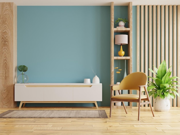 Interno del soggiorno con poltrona e mobile per tv su sfondo blu vuoto della parete. Rendering 3D