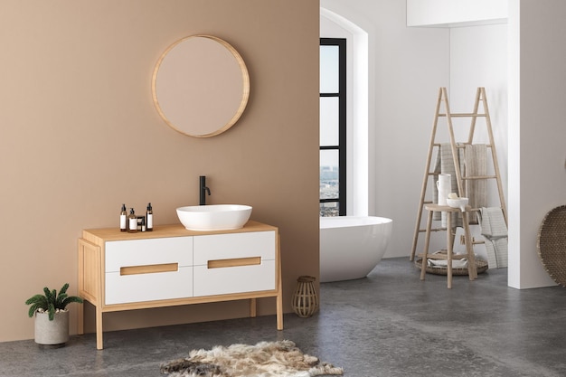 Interno moderno del bagno con pareti beige, lavabo bianco con specchio ovale, vasca da bagno e cemento grigio