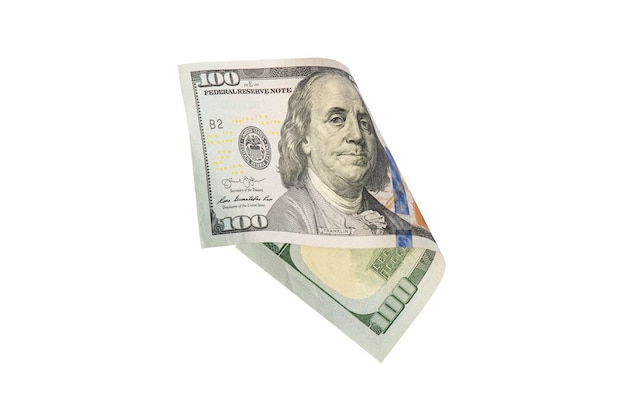 Isolare su bianco banconote da cento dollari denaro americano piegato a metà primo piano