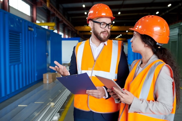 Ispettore Talking to Woman in Factory