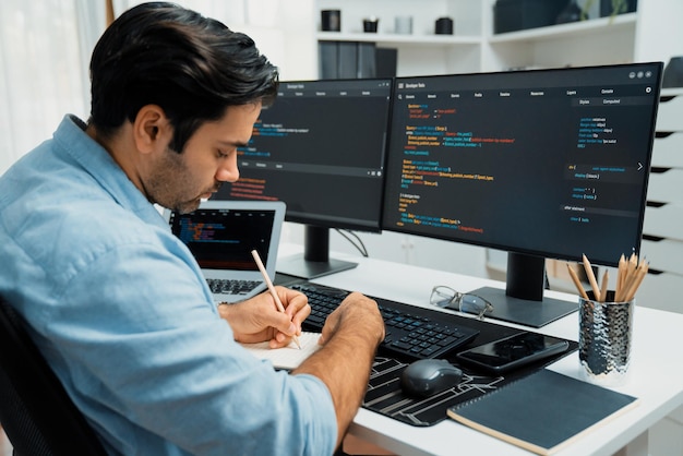 IT developer writing data memo software development on papers coding Surmise