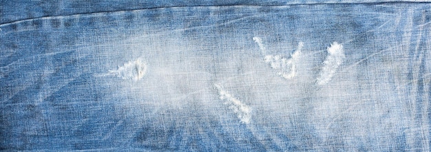 Jeans strappati moda denim texture design Blue denim jeans texture banner con spazio di copia per lo sfondo del design del testo Canvas denim fashion texture Banner di moda panoramica