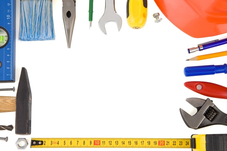 Foto kit di strumenti di costruzione isolati su bianco