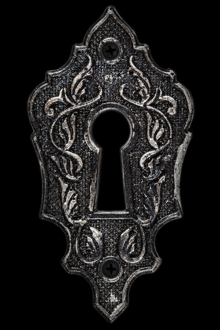 Foto l'elemento decorativo del buco della serratura isolato su sfondo nero
