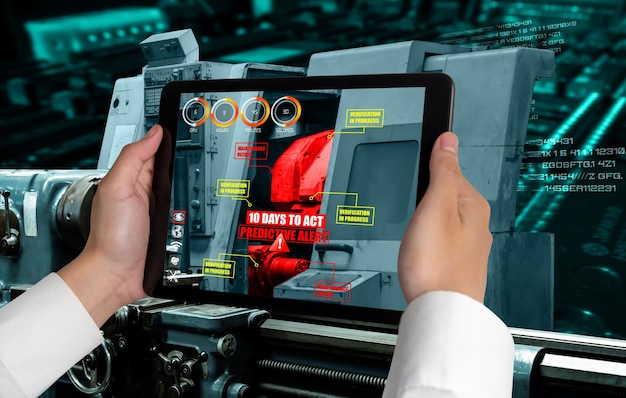 L'ingegnere utilizza il software di realtà aumentata nella linea di produzione della fabbrica intelligente