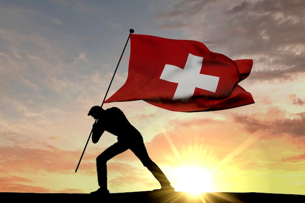La bandiera della Svizzera viene spinta nel terreno da un rendering 3D di silhouette maschile