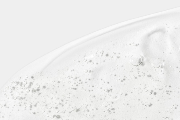 La consistenza del siero o del gel Crema trasparente con bolle sullo sfondo Gel cosmetico trasparente in primo piano xABolle di ossigeno xA