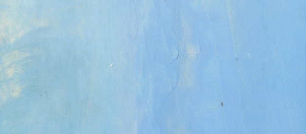 La consistenza della parete di cemento a vernice blu lo sfondo della parete a cemento averniciata presa da vicino