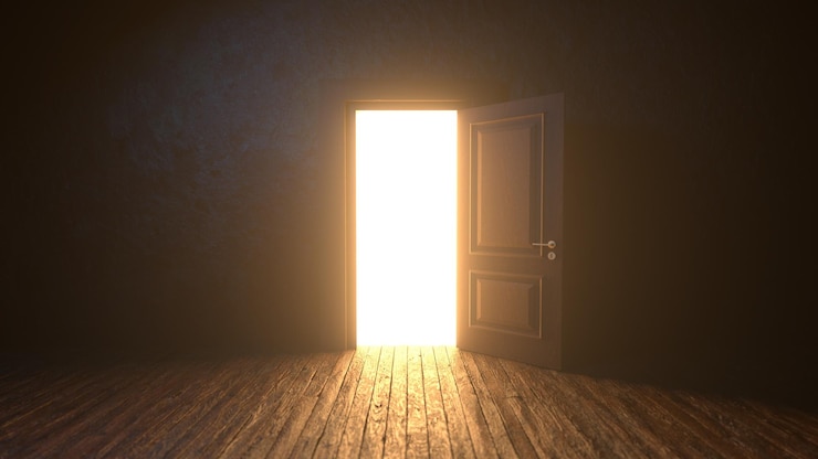 Foto la luce splende dall'apertura della porta in una stanza buia.