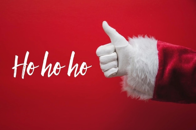 La mano di Babbo Natale saluta con un messaggio festivo