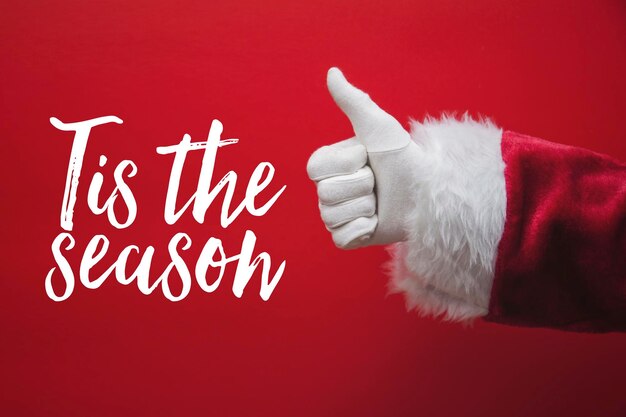 La mano di Babbo Natale saluta con un messaggio festivo