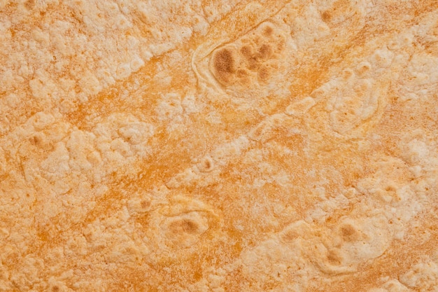 La tortilla di frumento aromatizzata al pomodoro messicano avvolge il fondo di struttura