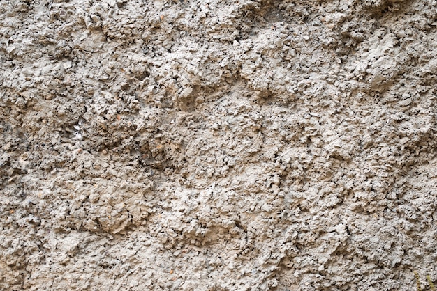 La trama dei vecchi muri di cemento grigio per lo sfondo, la superficie e il motivo del cemento grigio.