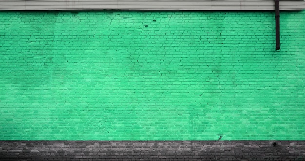 La trama del muro di mattoni di molte file di mattoni dipinti in colore verde