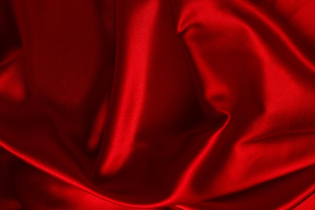 La trama del tessuto di lusso in seta rossa o satinata può essere utilizzata come sfondo astratto Vista dall'alto