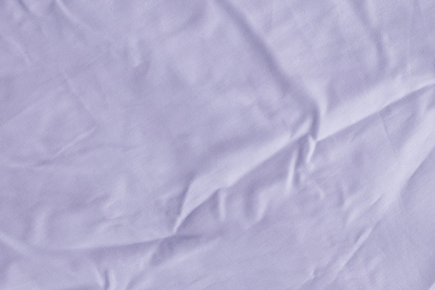 La trama del tessuto è sfondo di colore viola, pieghe ondulate di stoffa
