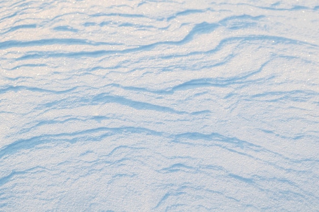 La trama strutturale della neve Inverno nevoso sfondo astratto Messa a fuoco selettiva