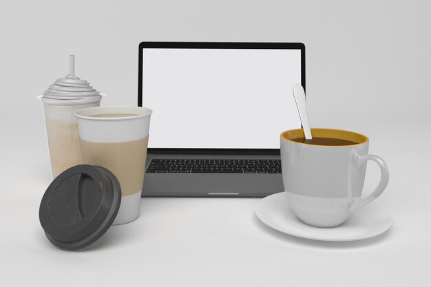 Laptop e tazze di caffè sul lato anteriore in uno sfondo bianco