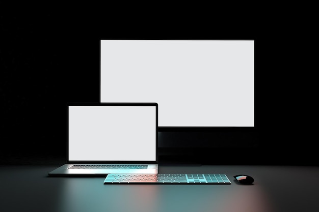 Lato anteriore di PC e laptop in uno sfondo scuro