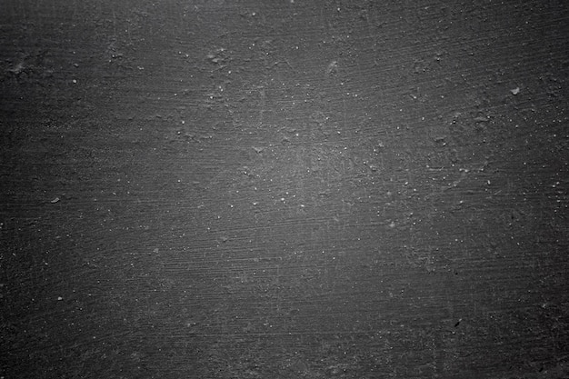 Lavagna grunge texture di sfondo bordi scuri Muro di cemento grezzo grigio nero per lo sfondo