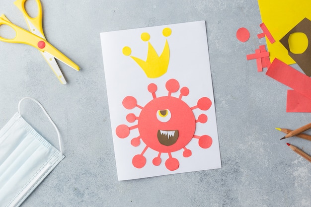 le mani dei bambini creano un collage di carte con il virus corona covid-19