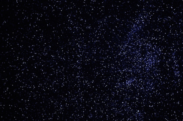 Le stelle blu nello spazio cielo sfocato luci blu particelle lucide sfondo astratto