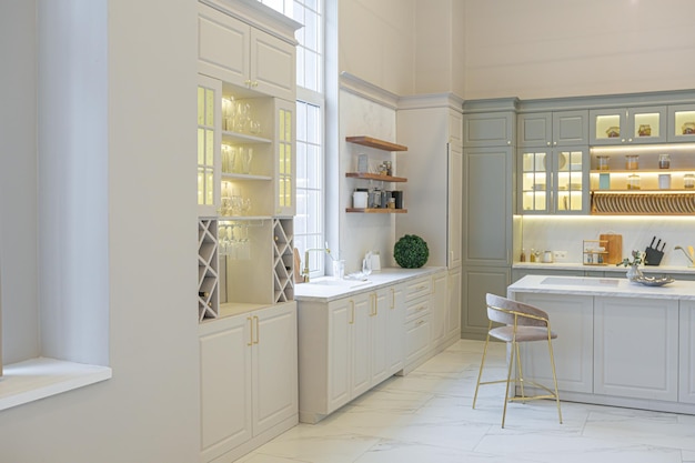 Le ultime tendenze della moda per la casa in un interno elegante ultra moderno di un accogliente studio in tenui colori pastello primi piani di una cucina elegante con un'isola per cucinare