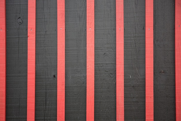 Legno bruciante Struttura rossa e nera del fondo Materiale e concetto della carta da parati