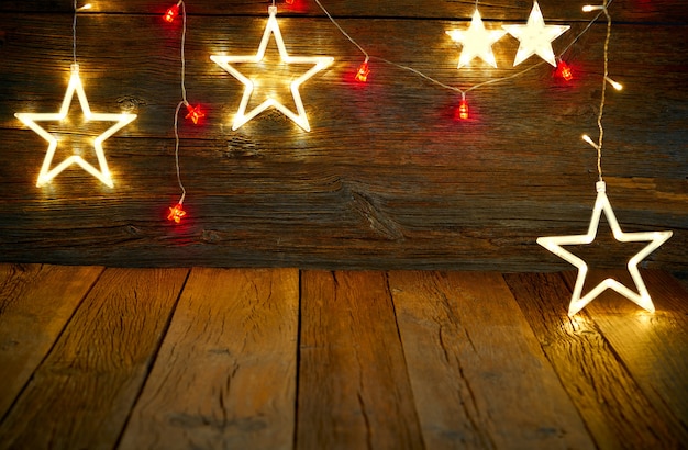 Legno rustico d&#39;annata delle stelle leggere di Natale