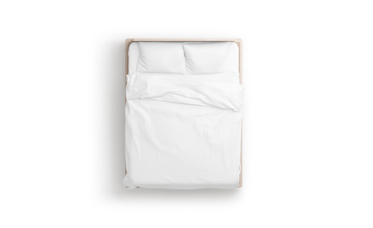 Foto letto bianco vuoto mockup di coperte e cuscini mockup in doss di rete con materasso e lenzuolo