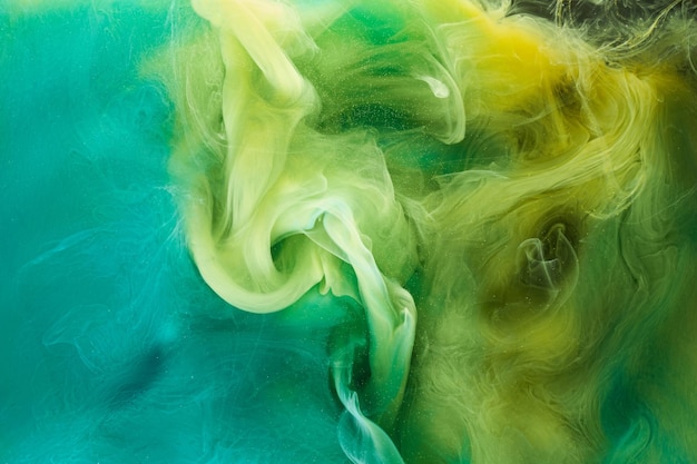 Liquido fluido arte sfondo astratto Verde giallo danza acrilica dipinge spazio subacqueo fumo oceano colore esplosione