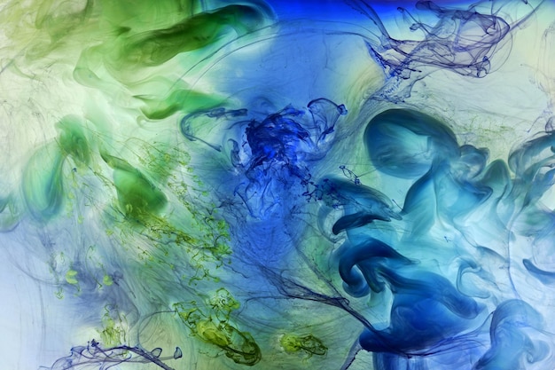 Liquido fluido arte sfondo astratto Vernice acrilica verde blu sott'acqua oceano di fumo galattico