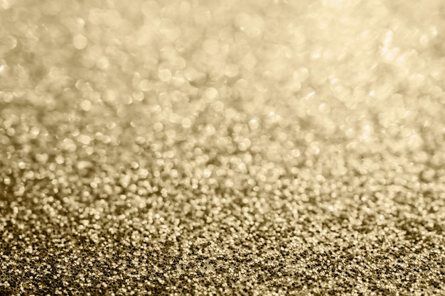 Lo scintillio astratto dell'oro sfocato dallo sfondo bokeh