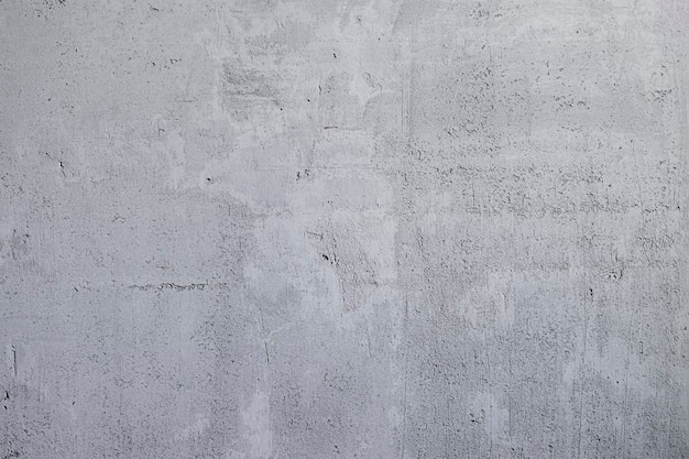 Lo sfondo astratto è la trama di una superficie di cemento grigio