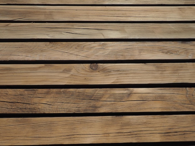 Lo sfondo è fatto di tavole lucide e laccate con cappelli a chiodo Marrone bellissimo legno Illuminazione sul lato