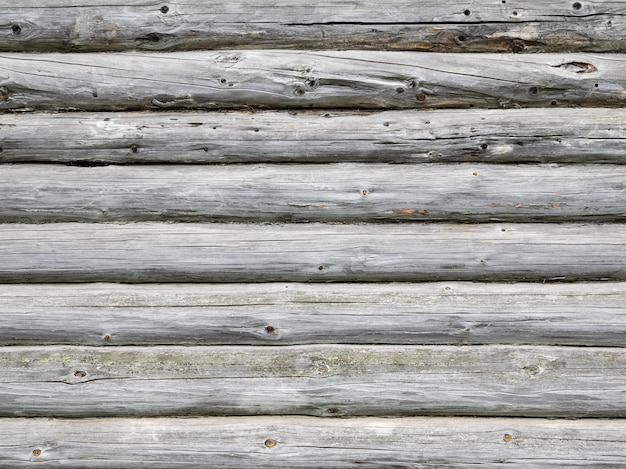 Lo sfondo grigio delle vecchie travi in legno.