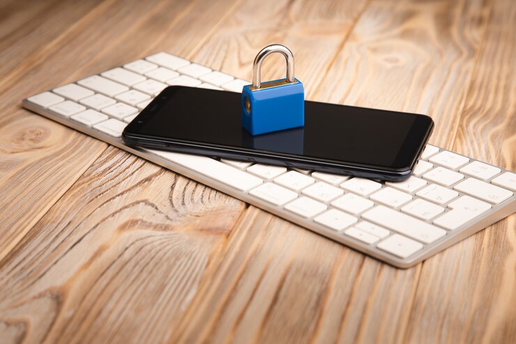 Photo lock on phone on computer keyboard