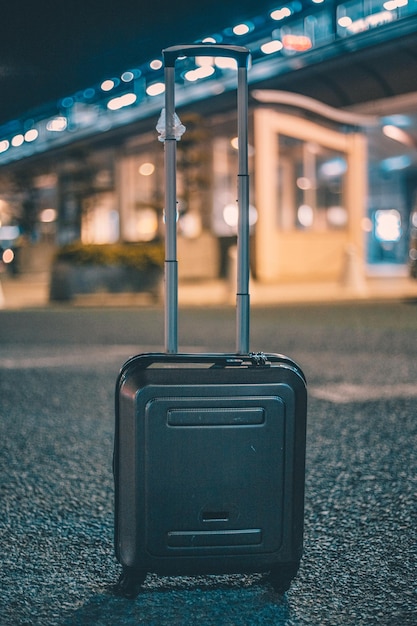 Luggage against airport at night