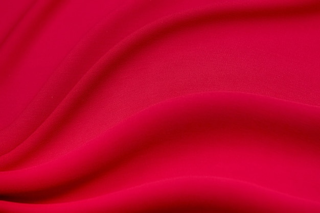 Lussuoso tessuto rosso in viscosa o seta. Sfondo e motivo.
