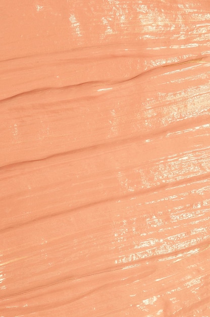 Macchia beige di carta da parati con texture di base tonale. Prodotti cosmetici per il trucco e il concetto di cura della pelle