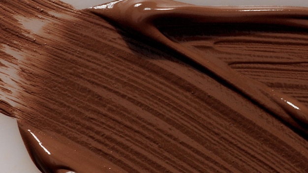 Macchie di consistenza del fondotinta liquido per trucco Macro cosmetica vista dall'alto Tonalità scure del fondotinta facciale