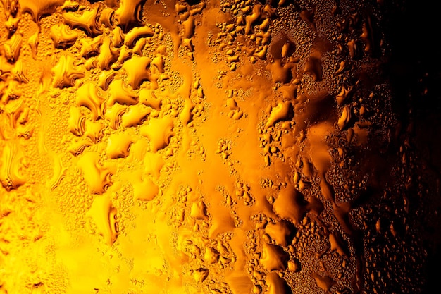 macro bottiglia di birra textureBeer sfondo Gocce d'acqua sullo sfondo