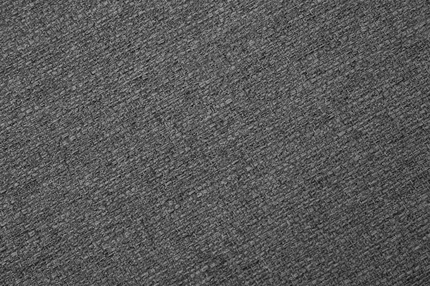 Macro close-up della consistenza del tessuto sullo sfondo grigio