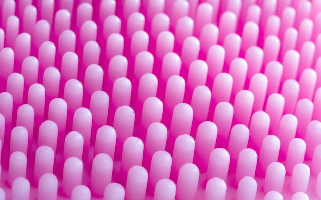 Macro pink spazzola da massaggio in silicone consistenza superficiale da vicino per lo sfondo