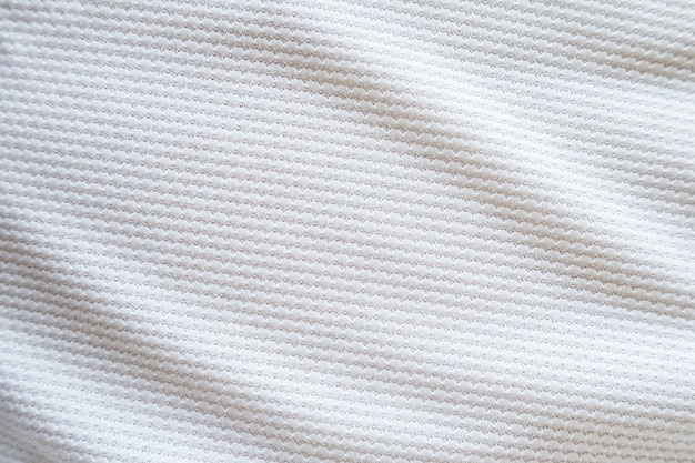 Maglia da calcio bianca abbigliamento tessuto trama abbigliamento sportivo sfondo, primi piani