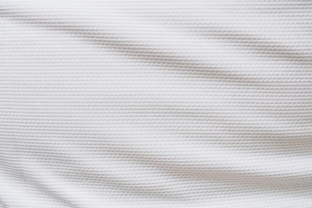 Maglia da calcio bianca abbigliamento tessuto trama abbigliamento sportivo sfondo, primo piano