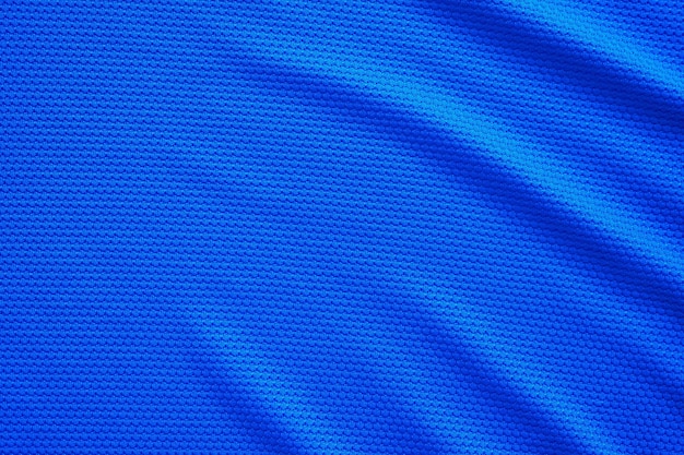 Maglia da calcio blu abbigliamento tessuto trama abbigliamento sportivo sfondo primo piano vista dall'alto