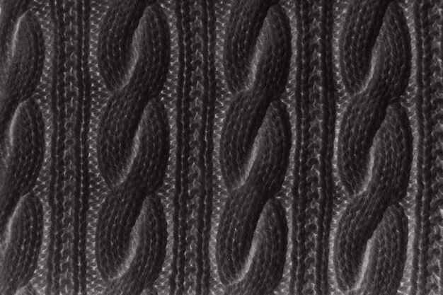 Maglia di grandi dimensioni di texture maglione o sciarpa. Fondo in jersey lavorato a maglia con motivo a rilievo.