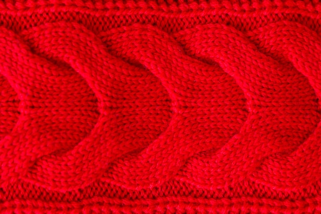 Maglione invernale lavorato a maglia rosso Texture di sfondo rosso