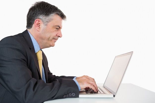 Man writing on his laptop